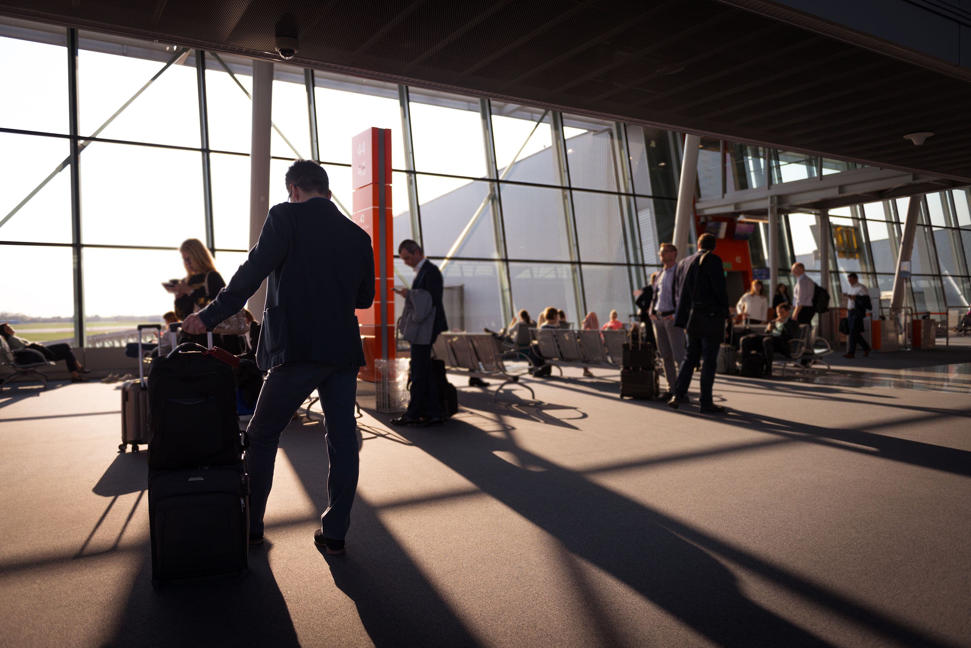 Traveler with suitcase at airport