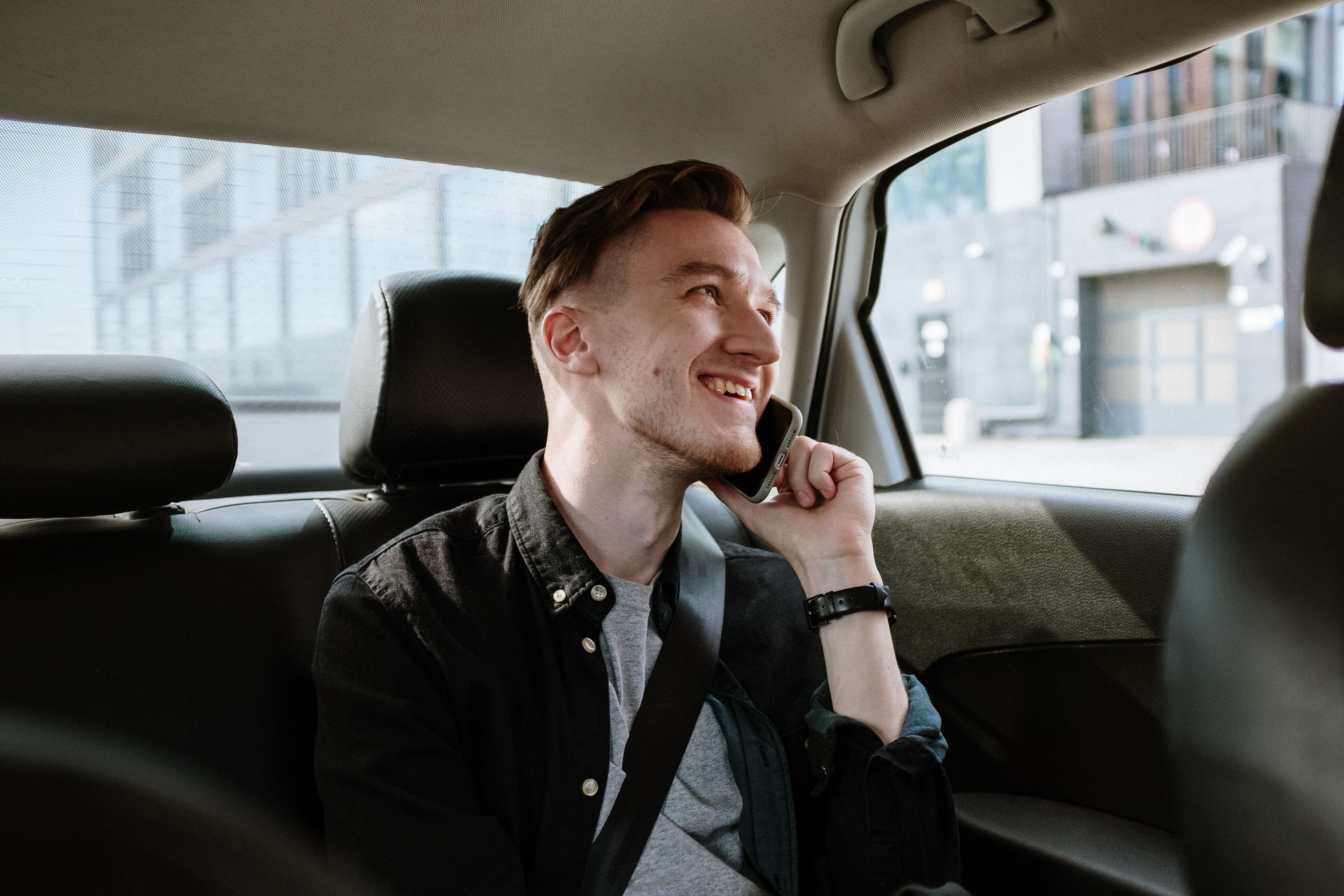 Passengers smiling in the car